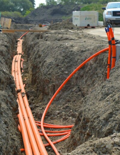 a trench with utility lines being installed